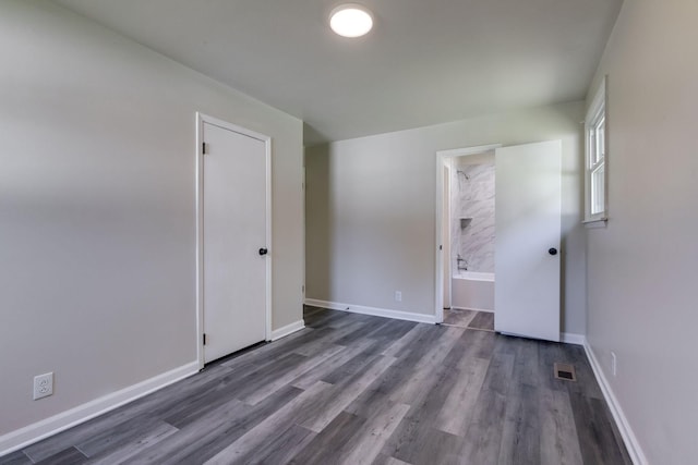 spare room with dark hardwood / wood-style flooring