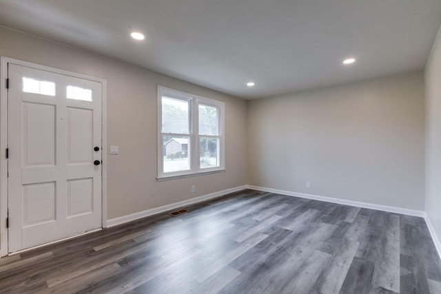 entryway with dark hardwood / wood-style floors