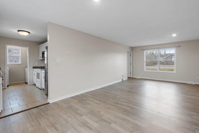 unfurnished living room featuring light hardwood / wood-style flooring