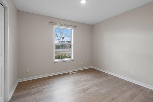 unfurnished room featuring light hardwood / wood-style flooring