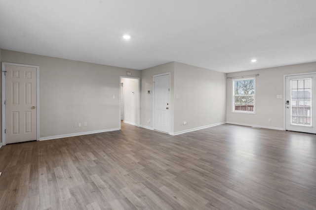 unfurnished living room with hardwood / wood-style floors