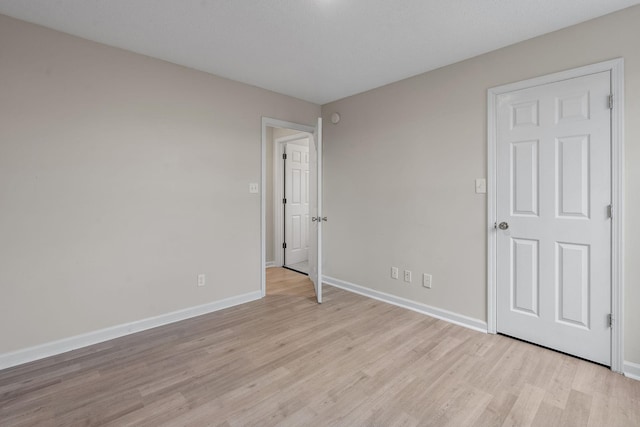 unfurnished bedroom featuring light wood-type flooring