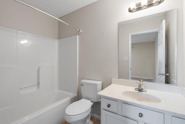 full bathroom featuring a textured ceiling, vanity, toilet, and  shower combination