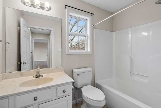 full bathroom with vanity, toilet, and  shower combination