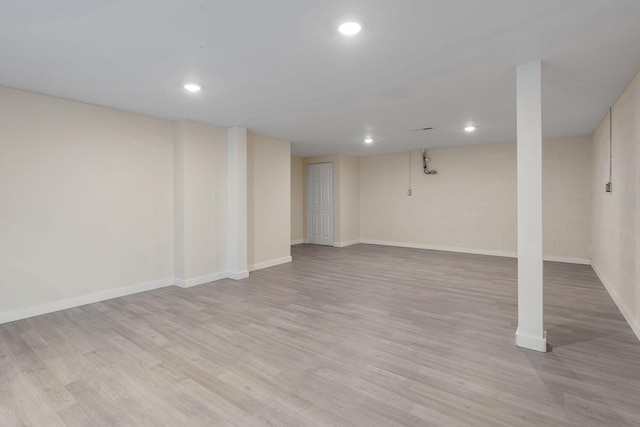 basement featuring light hardwood / wood-style floors