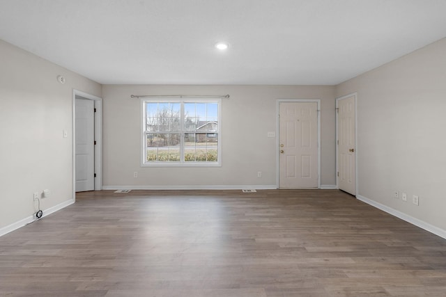 unfurnished room with light hardwood / wood-style floors