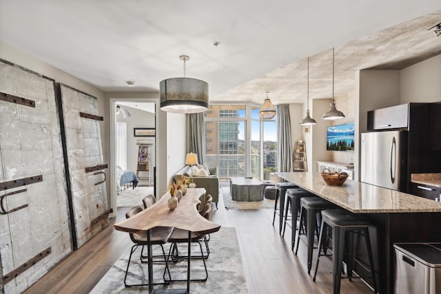 dining area with hardwood / wood-style floors