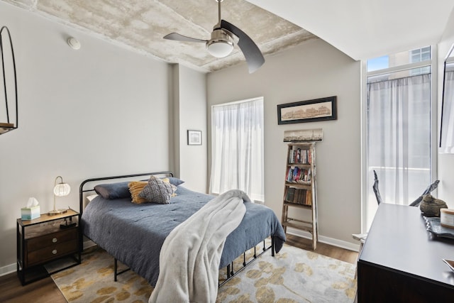 bedroom with wood-type flooring and ceiling fan