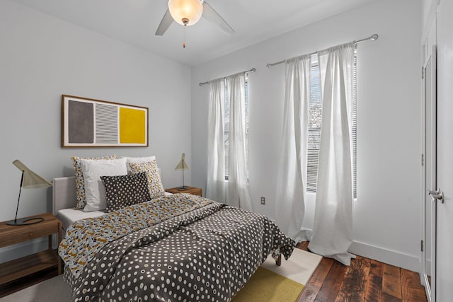 bedroom featuring ceiling fan and dark wood-type flooring