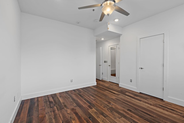 unfurnished bedroom with ceiling fan and dark hardwood / wood-style floors