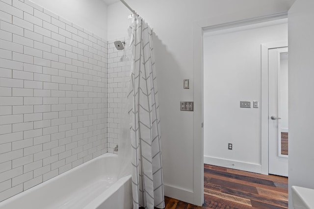 bathroom featuring shower / bath combo and wood-type flooring