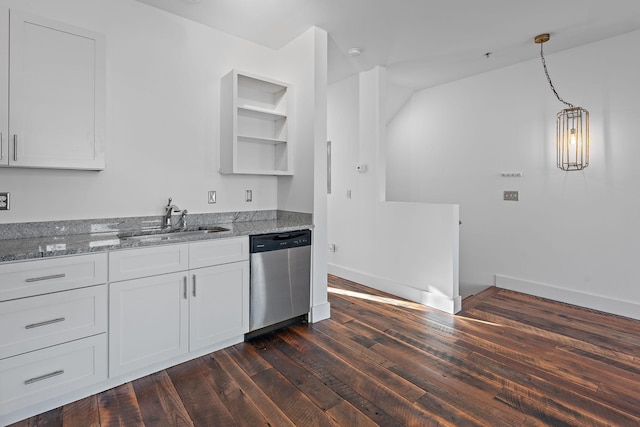 kitchen with light stone counters, stainless steel dishwasher, sink, decorative light fixtures, and white cabinetry