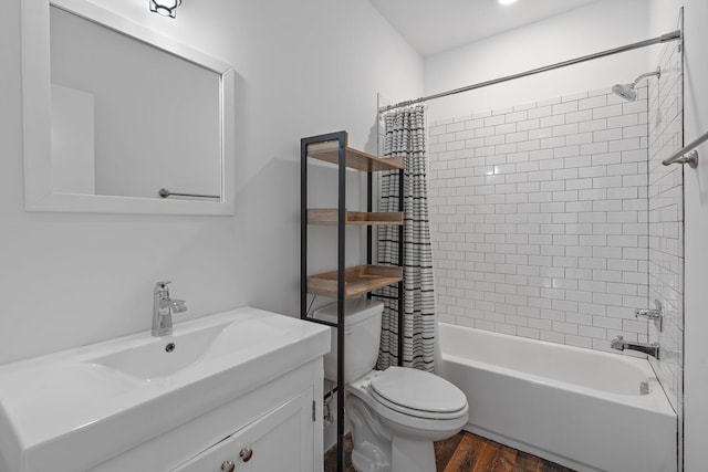 full bathroom with hardwood / wood-style floors, shower / bath combo, toilet, and vanity