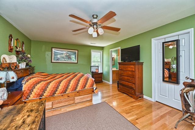 bedroom featuring ceiling fan and light hardwood / wood-style flooring