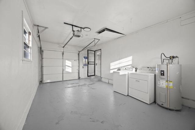 garage with washing machine and dryer, water heater, and a garage door opener