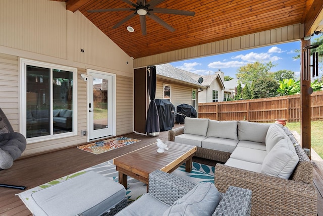 wooden terrace featuring outdoor lounge area, ceiling fan, and grilling area