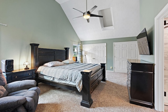 bedroom featuring multiple closets, ceiling fan, high vaulted ceiling, and light colored carpet