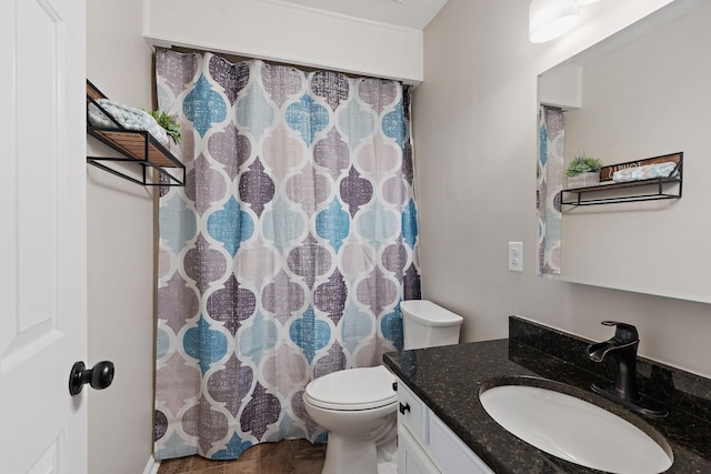 bathroom with vanity and toilet