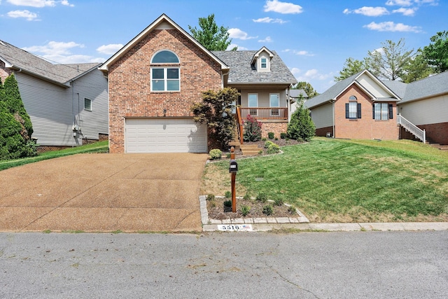 view of property featuring a garage and a front lawn