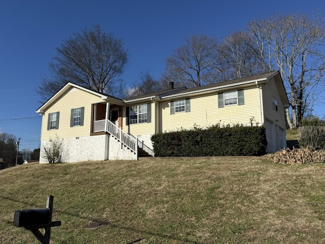 view of front facade featuring a garage and a front lawn