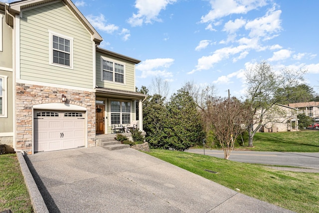 front facade featuring a garage and a front lawn