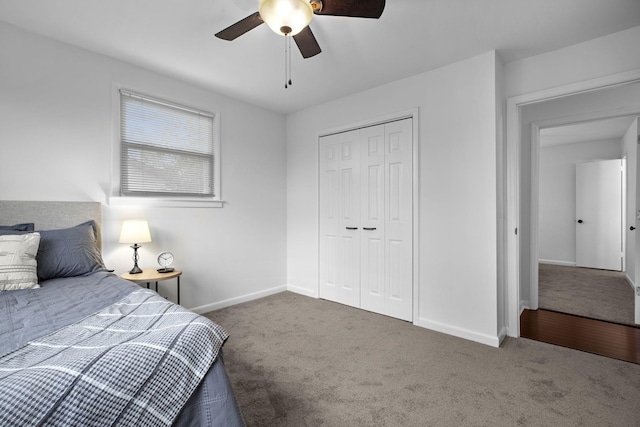 carpeted bedroom with ceiling fan and a closet