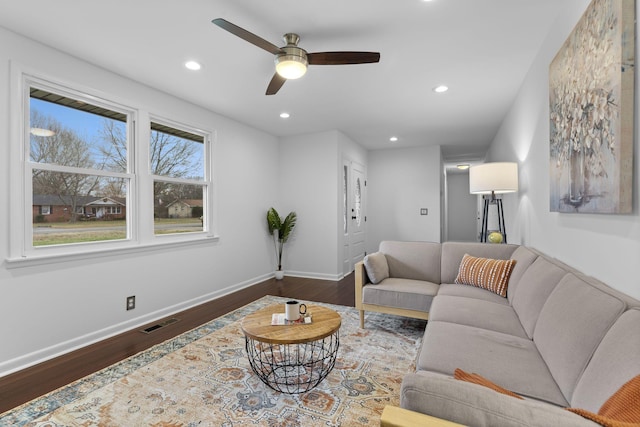 living room featuring ceiling fan and wood-type flooring