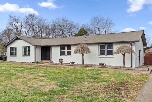 ranch-style house with a front lawn