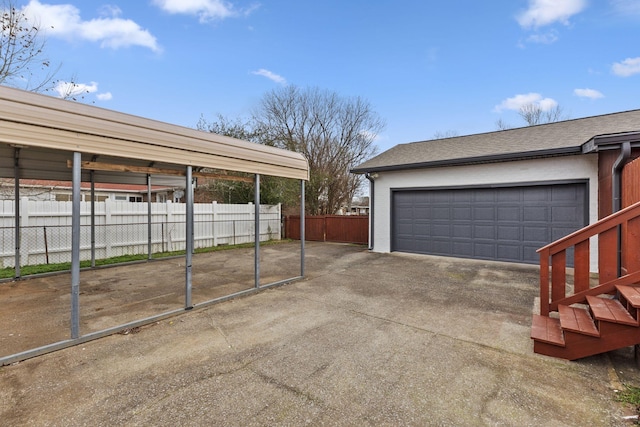 garage featuring a carport