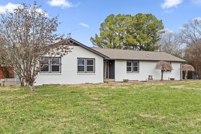 ranch-style home with a front yard