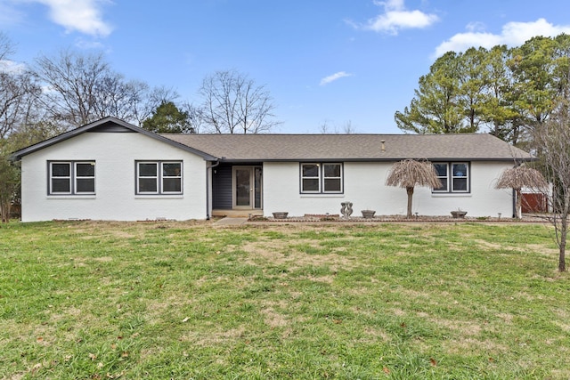 ranch-style house featuring a front lawn