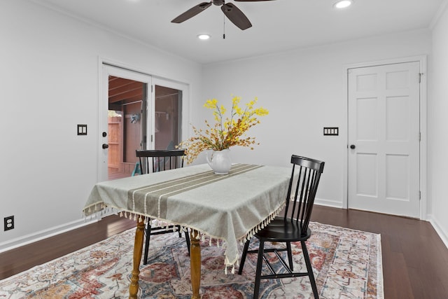 dining area with ceiling fan, dark hardwood / wood-style floors, and crown molding