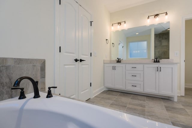 bathroom featuring tile patterned flooring and vanity