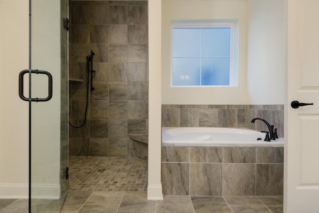 bathroom with separate shower and tub and tile patterned flooring