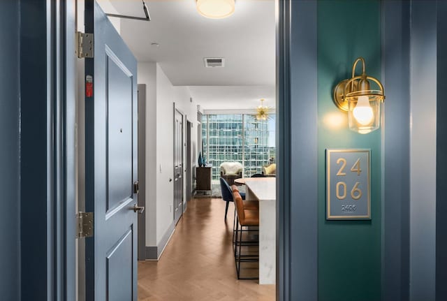 hallway featuring parquet floors