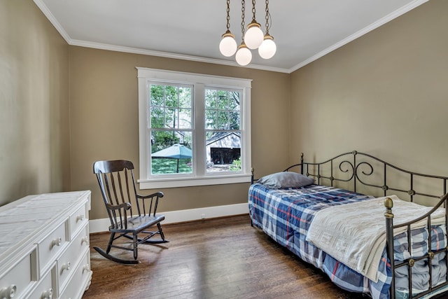 bedroom with dark hardwood / wood-style floors, crown molding, and an inviting chandelier