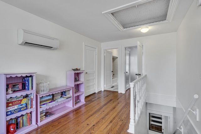 interior space featuring dark hardwood / wood-style floors and a wall unit AC