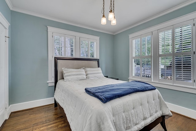 bedroom with a notable chandelier, ornamental molding, and multiple windows