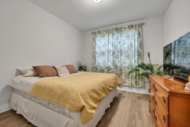 bedroom with wood-type flooring