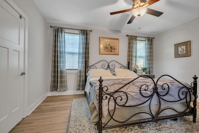 bedroom featuring ceiling fan and light hardwood / wood-style flooring