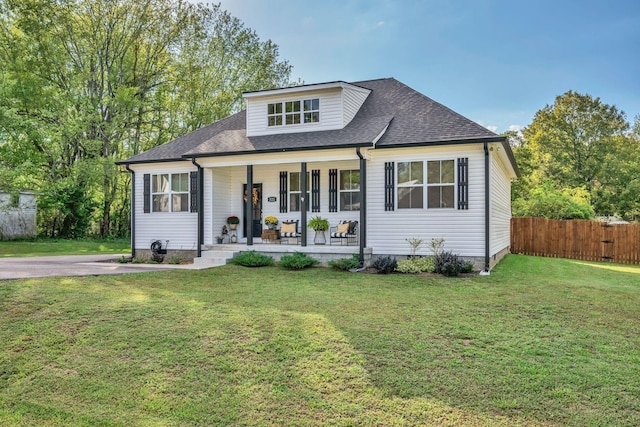 bungalow-style house with a porch and a front lawn