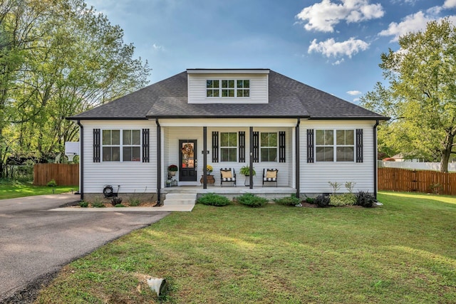 bungalow-style house with a front yard and a porch