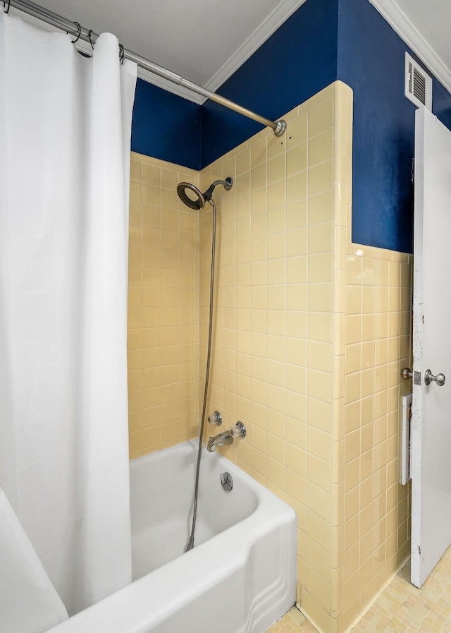 bathroom featuring tile patterned flooring, shower / tub combo, and ornamental molding