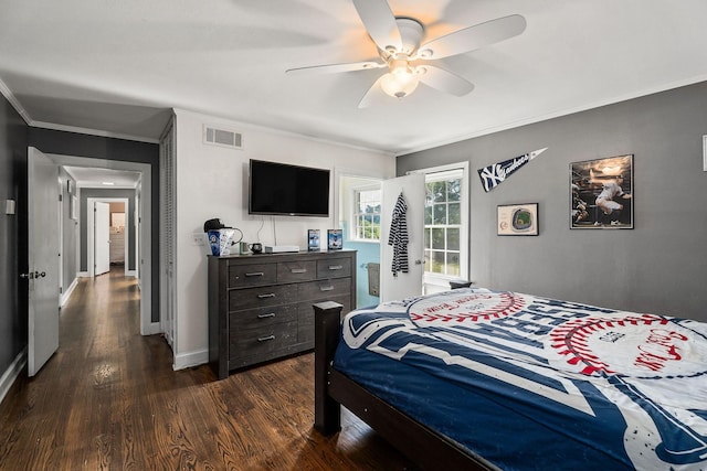 bedroom with dark hardwood / wood-style flooring, ceiling fan, and ornamental molding