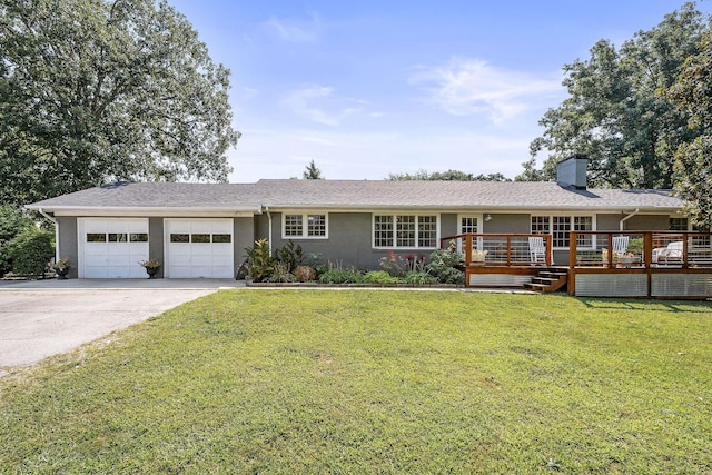 ranch-style home featuring a front yard, a garage, and a wooden deck