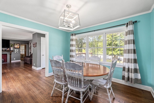 dining space with crown molding and dark hardwood / wood-style flooring