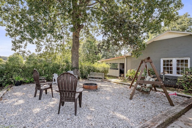 view of patio / terrace featuring an outdoor fire pit