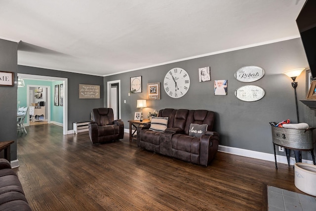 living room featuring dark hardwood / wood-style flooring and crown molding