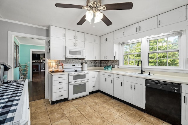 kitchen featuring sink, white cabinets, white appliances, and light tile patterned floors