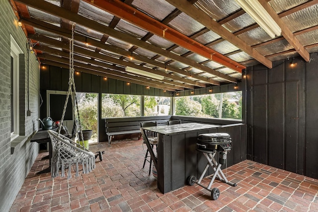 sunroom / solarium with vaulted ceiling